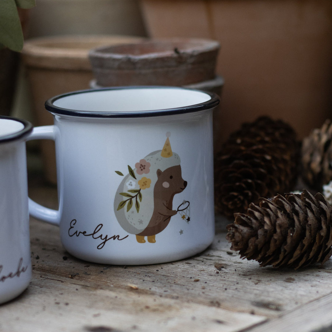 A personalised children's ceramic mug printed with a magical hedgehog illustration