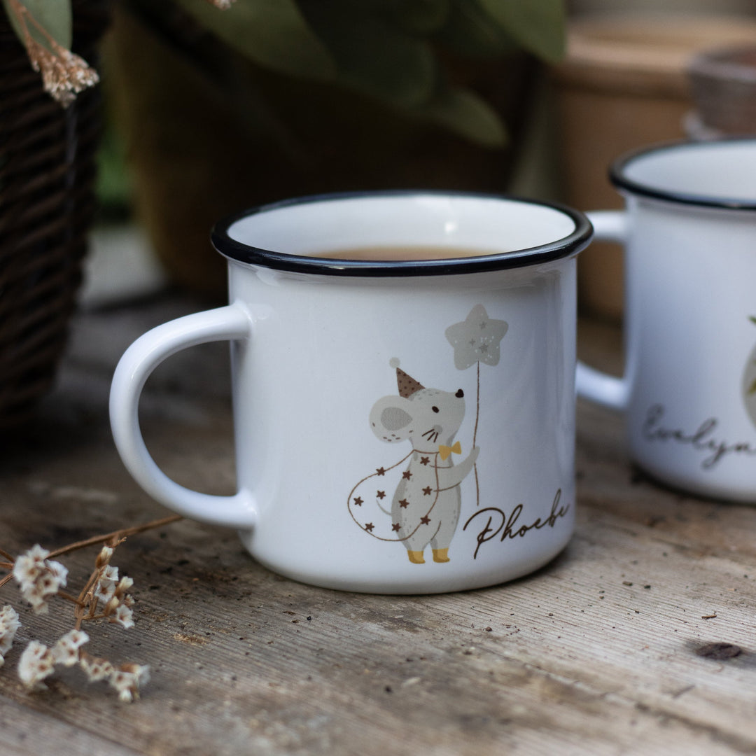 A personalised children's ceramic mug printed with a magical mouse illustration