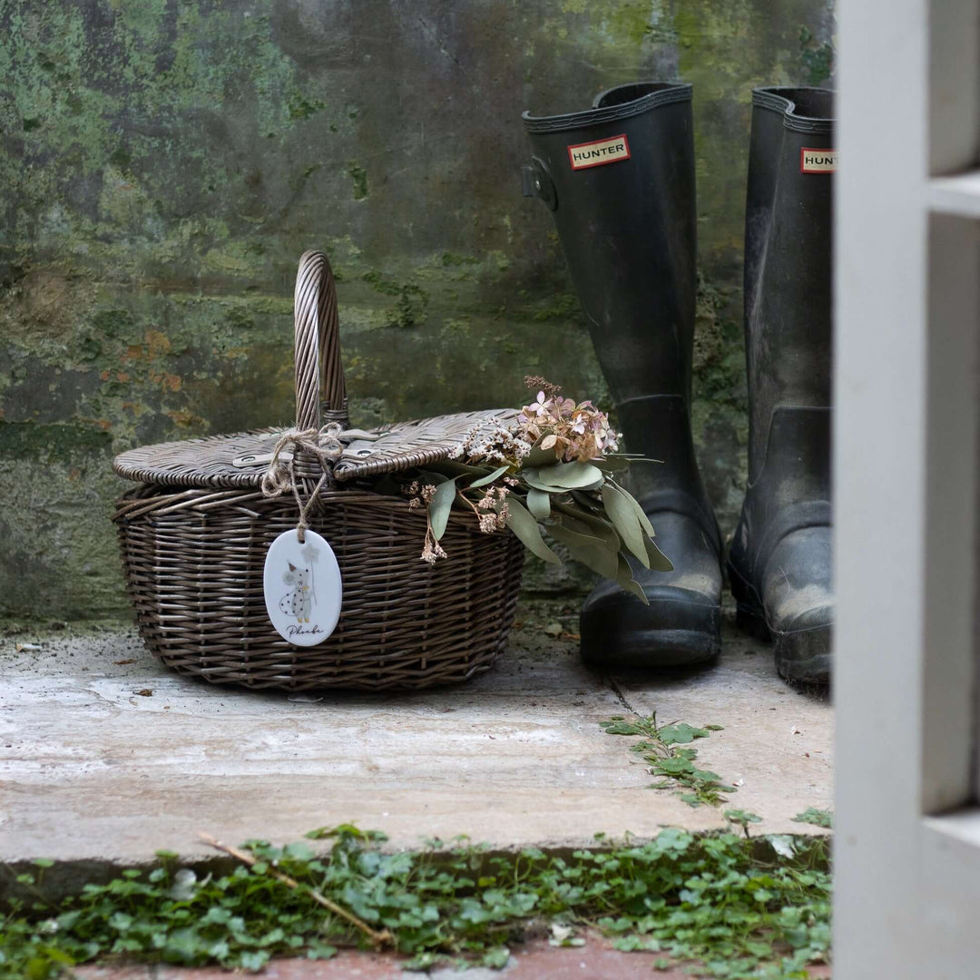 Children's wicker picnic basket with personalised ceramic tag featuring a mouse illustration