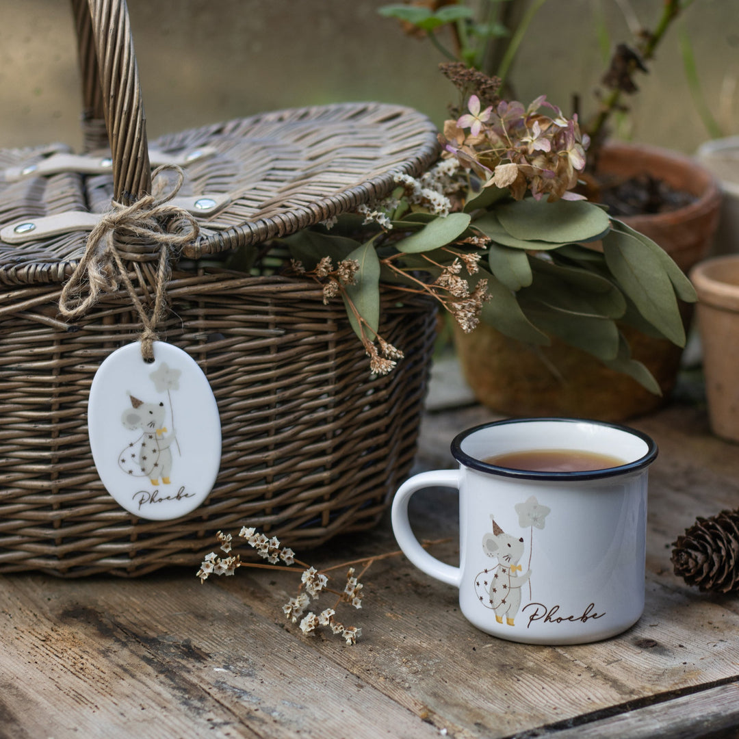 Children's wicker picnic basket with personalised ceramic tag featuring a mouse illustration and matching mug