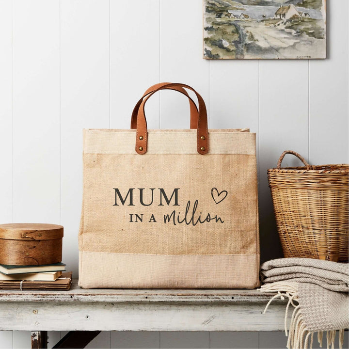 Mum In A Million market tote made from natural jute featuring leather handles by Tillyanna, perfect for sustainable gifting.